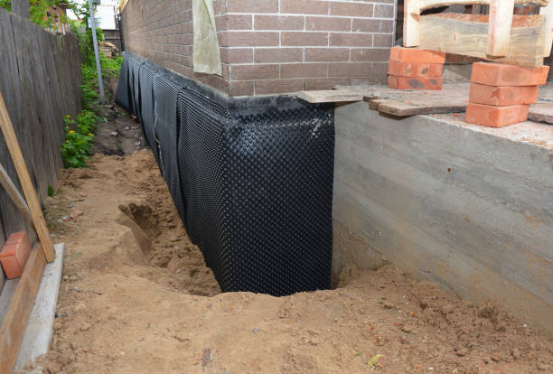 Happy homeowners after waterproofing job in Teterboro